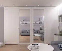 White wardrobe in the bedroom in the interior photo