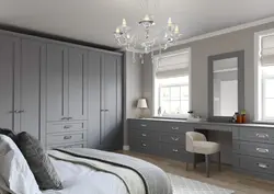 White wardrobe in the bedroom in the interior photo