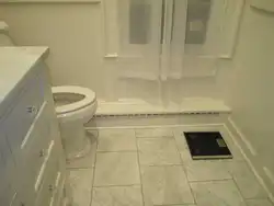 Bathroom floor plinth on tiles photo