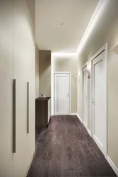 Hallway Design In An Apartment With Dark Floors