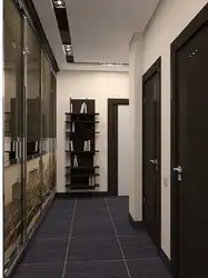 Hallway design in an apartment with dark floors