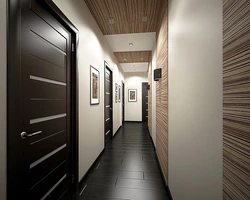 Hallway design in an apartment with dark floors