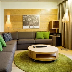 Зеленый ковер в интерьере гостиной