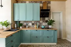 What color goes with mint in the kitchen interior photo