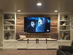 Chest of drawers on the entire wall in the living room photo