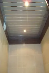 Ceiling made of aluminum panels in the bathroom photo