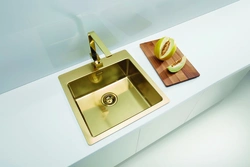 Gold sink in the kitchen photo