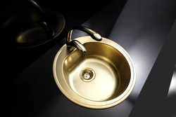 Gold sink in the kitchen photo