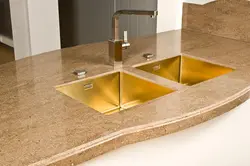Gold sink in the kitchen photo