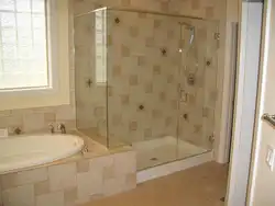 Shower and bath together in the bathroom photo