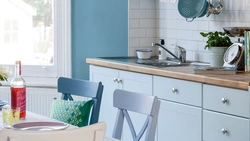 White kitchen with blue walls photo