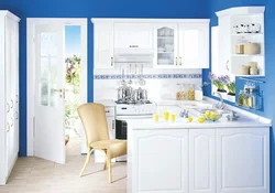 White kitchen with blue walls photo