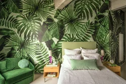 Leaves on the wall in the bedroom interior