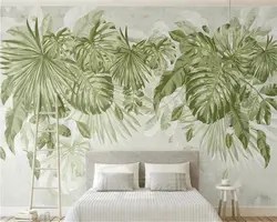 Leaves on the wall in the bedroom interior