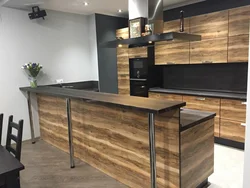 Dark kitchen with wood photo