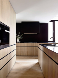 Dark kitchen with wood photo