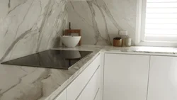Marble-effect porcelain tiles in the kitchen interior photo