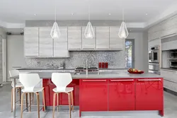 Gray wallpaper and red kitchen interior