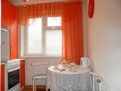 Kitchen design with orange curtains