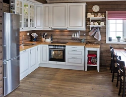 Interior with gray kitchen in a wooden house