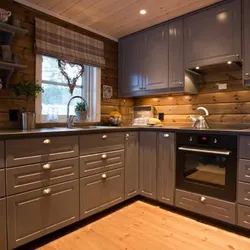 Interior with gray kitchen in a wooden house