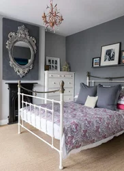 White metal bed in the bedroom interior