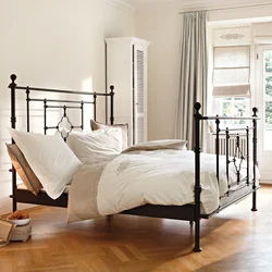 White Metal Bed In The Bedroom Interior