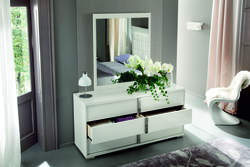 Bedroom design with chest of drawers and mirror photo