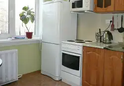 Location of the refrigerator and stove in the kitchen photo