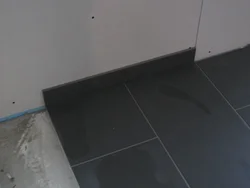 Plinth on tiles on kitchen floor photo