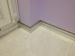 Plinth on tiles on kitchen floor photo