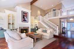 Living room design with stairs and fireplace