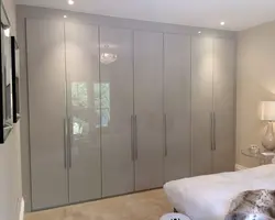 Bedroom wardrobe with hinged doors, light photo