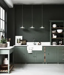 Dark green kitchen in the interior