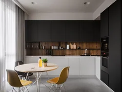 Black beige kitchen in the interior photo