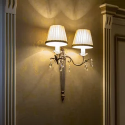 Lamps above the mirror in the hallway in the interior