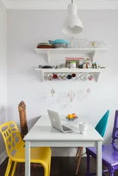 Shelves above the table in the kitchen interior photo