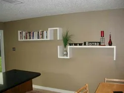Shelves above the table in the kitchen interior photo