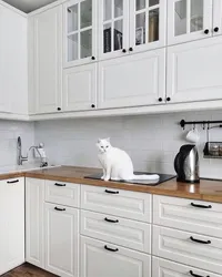 White kitchen design with white tiles