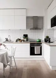 White kitchen design with white tiles