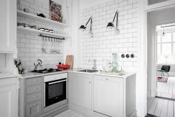 White kitchen design with white tiles