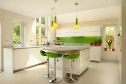Green Chairs In The Interior Of A White Kitchen