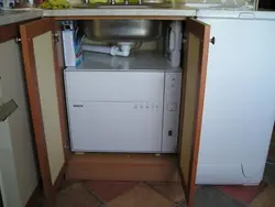 Dishwasher under the kitchen sink photo