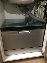 Dishwasher under the kitchen sink photo