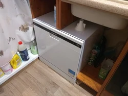 Dishwasher under the kitchen sink photo