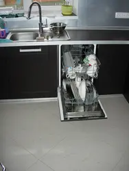 Dishwasher under the kitchen sink photo