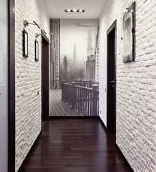 White brick in the interior of the hallway with wallpaper
