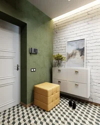 White brick in the interior of the hallway with wallpaper