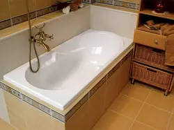 Installation of a bathtub in the bathroom photo