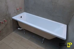 Installation of a bathtub in the bathroom photo